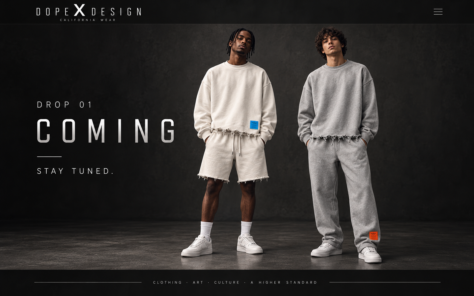 Two models in the Drop 01 looks: a bone sweatshirt and raw-hem shorts with a blue label, and a grey sweatshirt and sweatpants with an orange label.